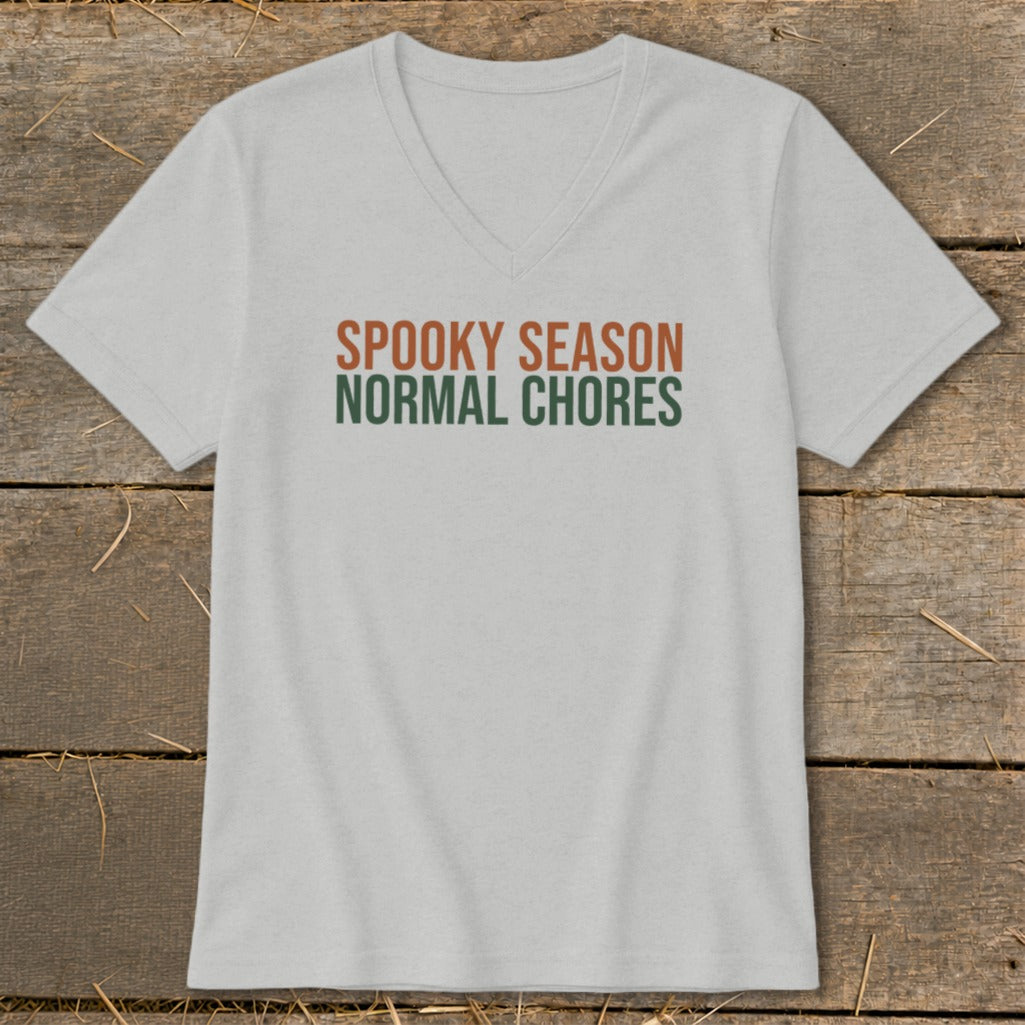 Light gray v-neck t-shirt with "Spooky Season Normal Chores" text.