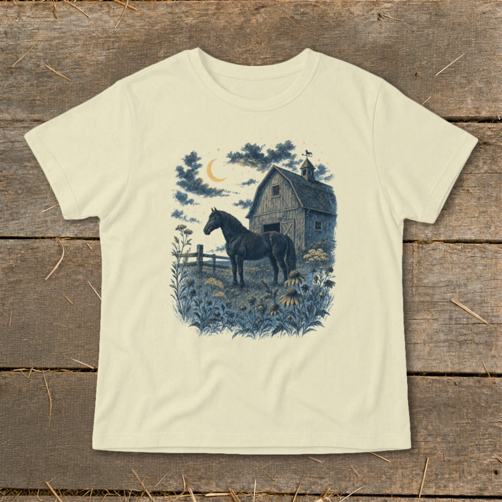 A dark horse stands near a barn under a crescent moon and cloudy night sky.