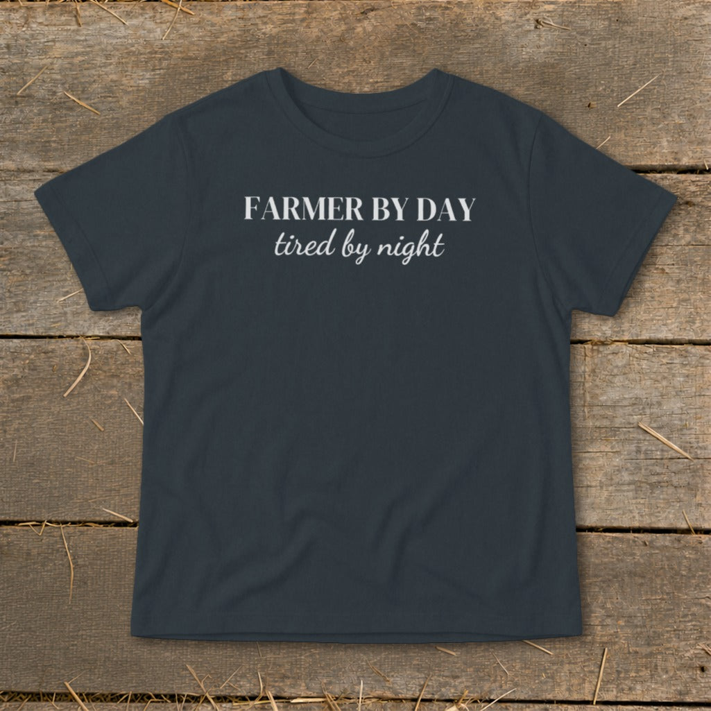 Dark gray t-shirt with white text "FARMER BY DAY tired by night".