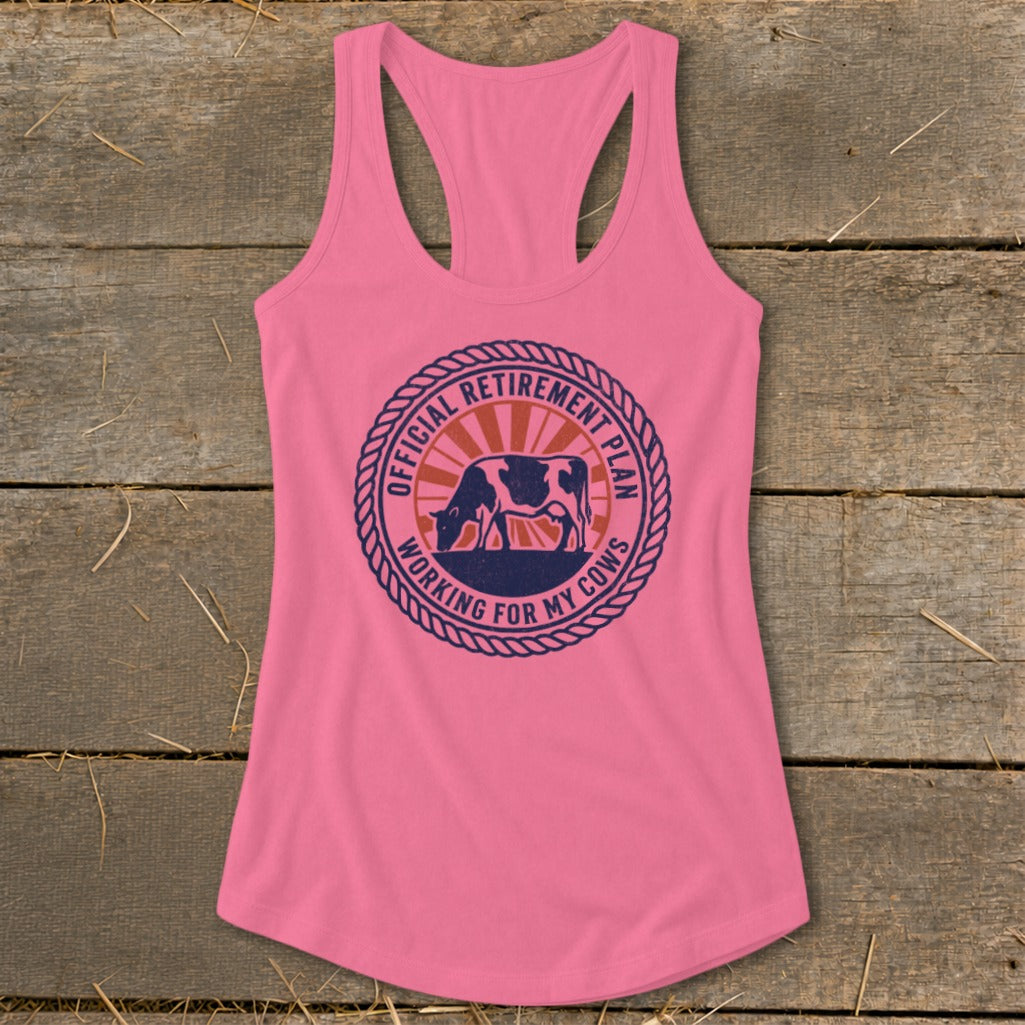 Pink tank top with a circular graphic of a cow and text reading "Official Retirement Plan Working For My Cows."