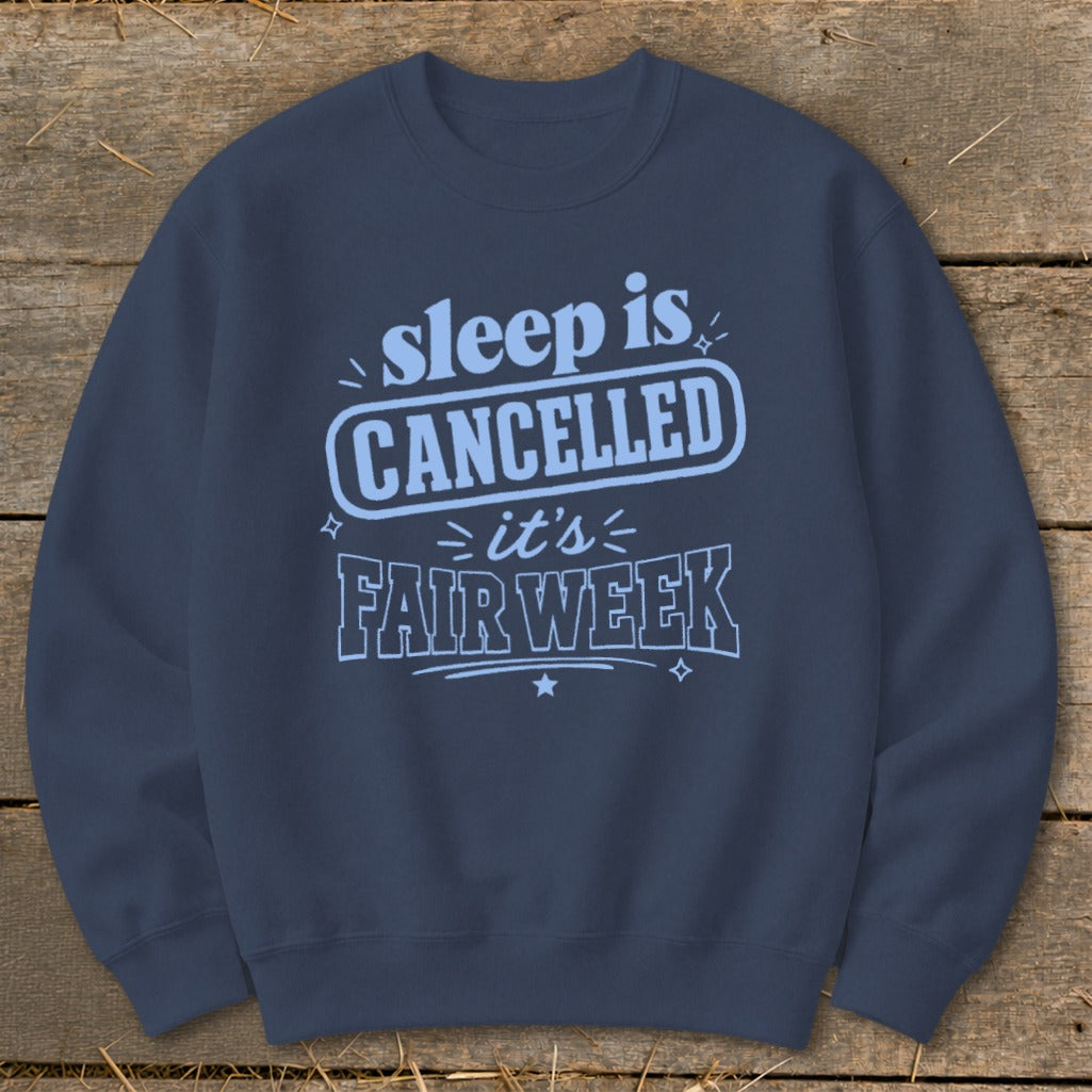 Navy sweatshirt with "sleep is CANCELLED it's FAIR WEEK" text.