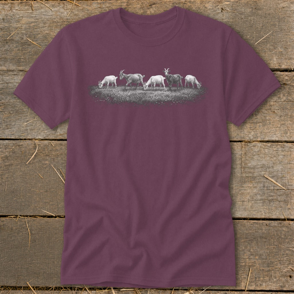 T-shirt with a graphic of five goats grazing in a field.