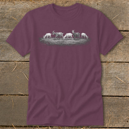 T-shirt with a graphic of five goats grazing in a field.