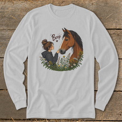Illustration of girl touching horse's nose, with "Boop" text and flowers.