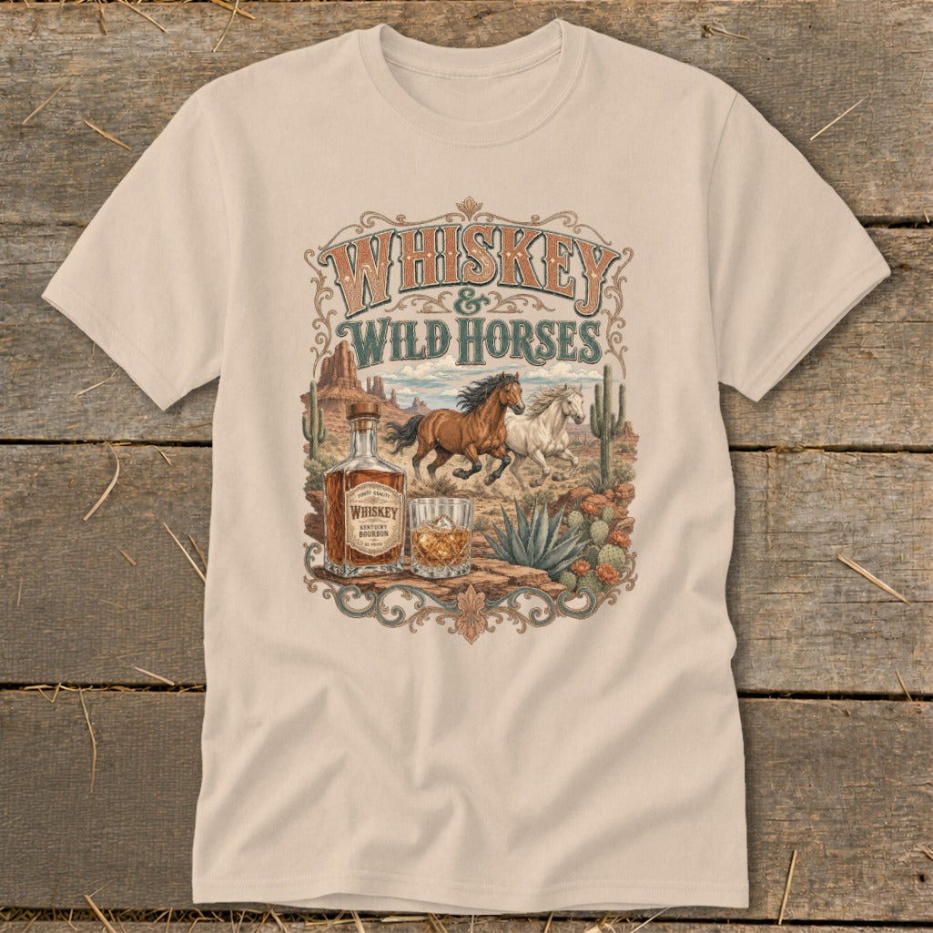 Whiskey & Wild Horses graphic tee with horses, whiskey bottle, and desert scene.