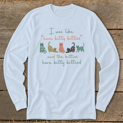 Light blue long-sleeve shirt with cats and text "I was like 'here kitty kitties' and the kitties here kitty kittied".