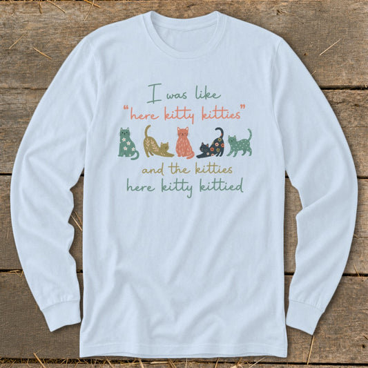 Light blue long-sleeve shirt with cats and text "I was like 'here kitty kitties' and the kitties here kitty kittied".