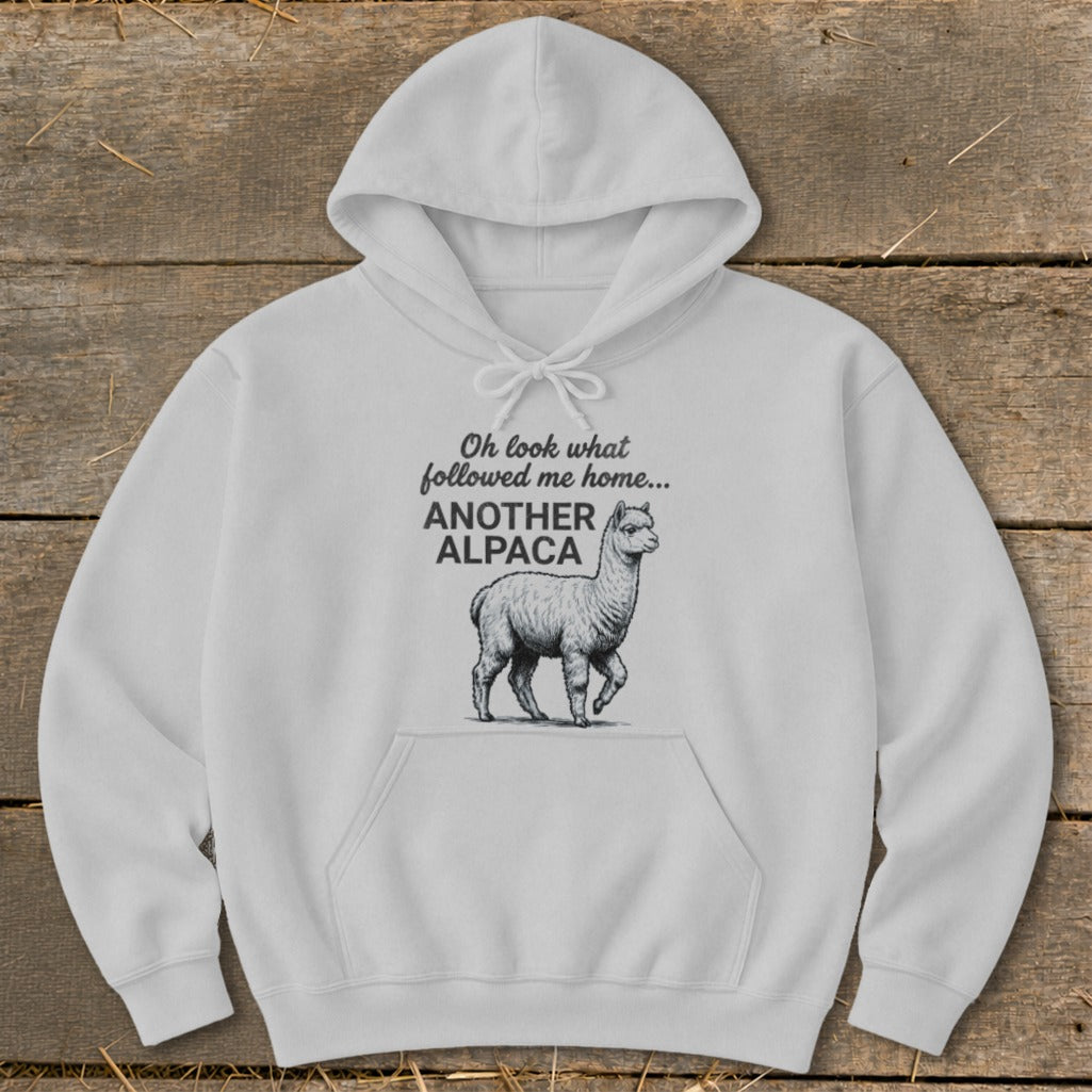 White hoodie with "Oh look what followed me home... ANOTHER ALPACA" and alpaca graphic.