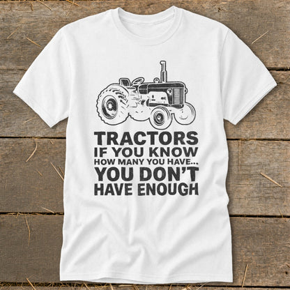 White t-shirt with tractor graphic and text: "Tractors If You Know How Many You Have... You Don't Have Enough"