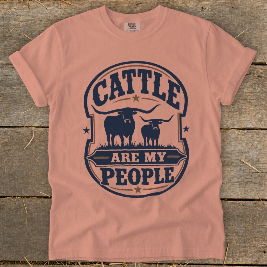 Peach t-shirt with a navy graphic of two cattle and text "CATTLE ARE MY PEOPLE".