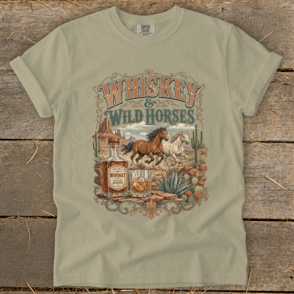 Whiskey & Wild Horses graphic on a tan t-shirt with desert scene.