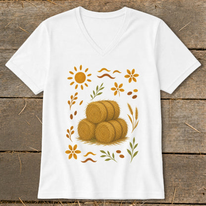 White t-shirt with a graphic of hay bales surrounded by autumn-themed elements.