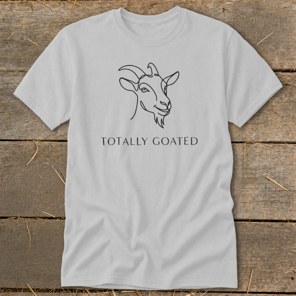 Light gray t-shirt with a line drawing of a goat and text "TOTALLY GOATED".