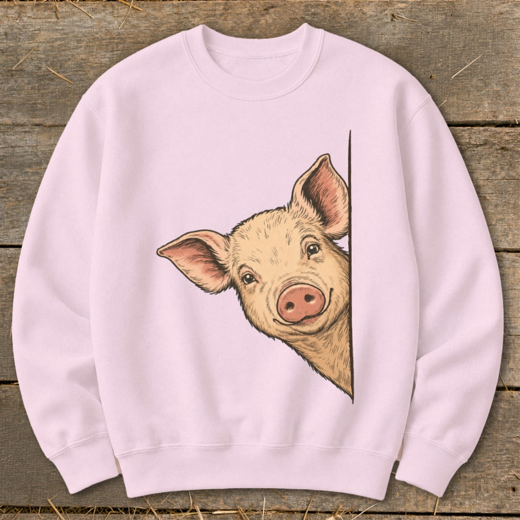 Pink sweatshirt with a happy pig peeking from behind a white surface.