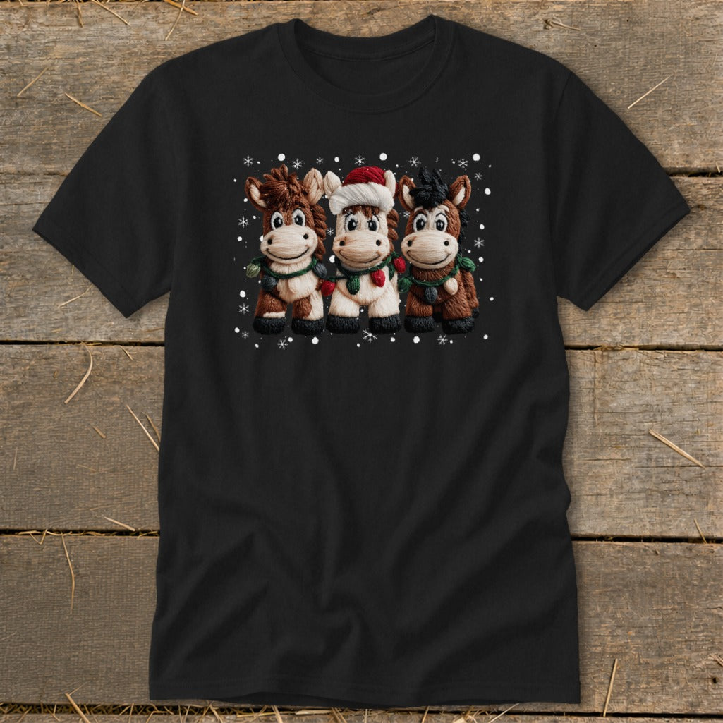 Three cartoon horses wearing Christmas lights and a Santa hat, with snowflakes.