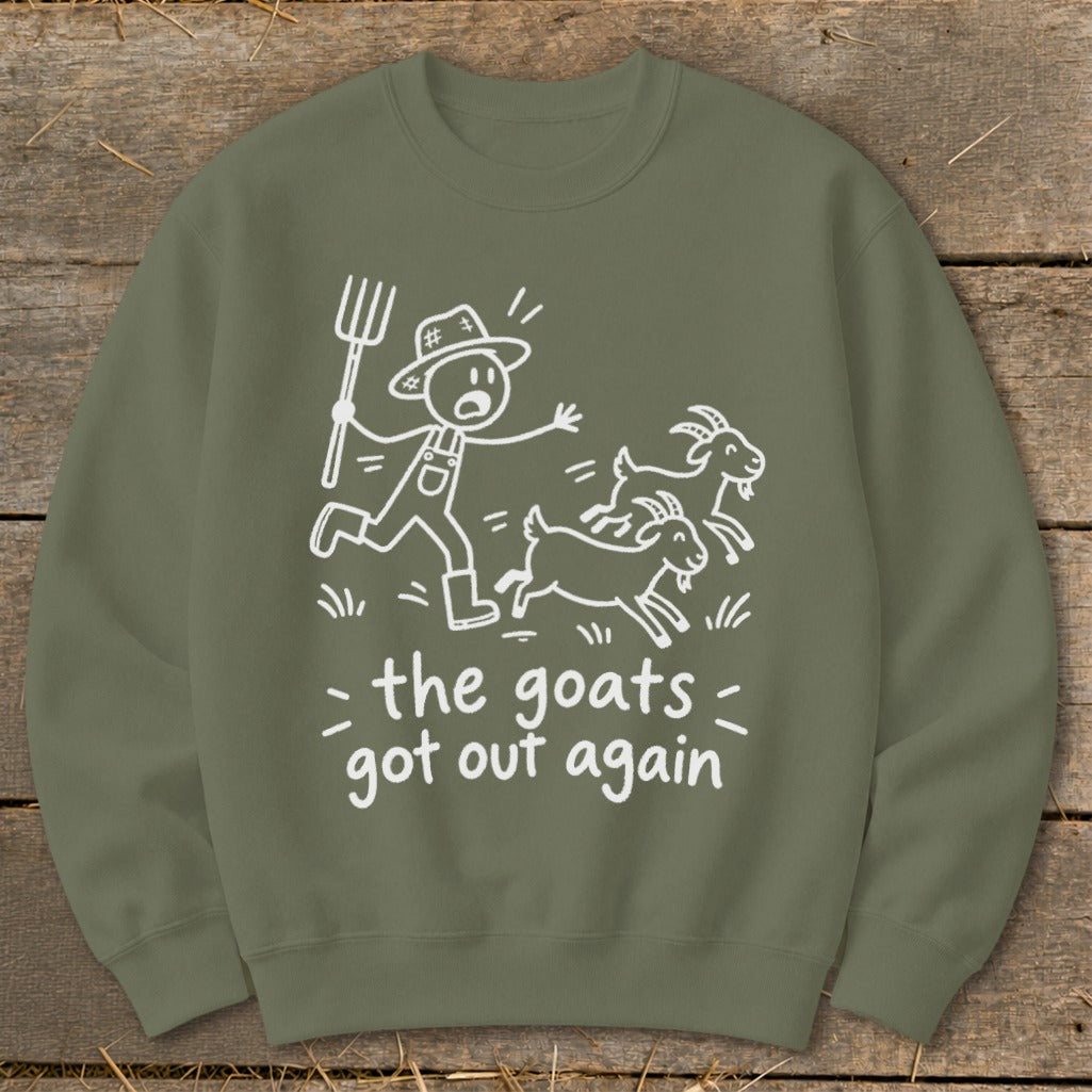 Crew neck sweatshirt with white drawing of a farmer chasing three goats and text "the goats got out again".