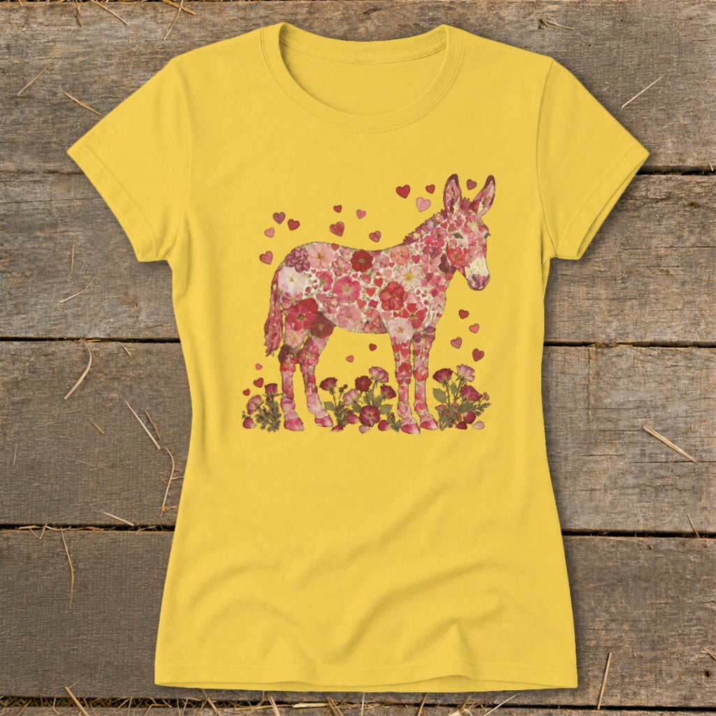 Yellow t-shirt featuring a donkey silhouette filled with pink and red flowers and hearts.