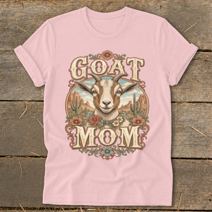 Pink t-shirt with "GOAT MOM" text and a goat illustration in a desert scene.