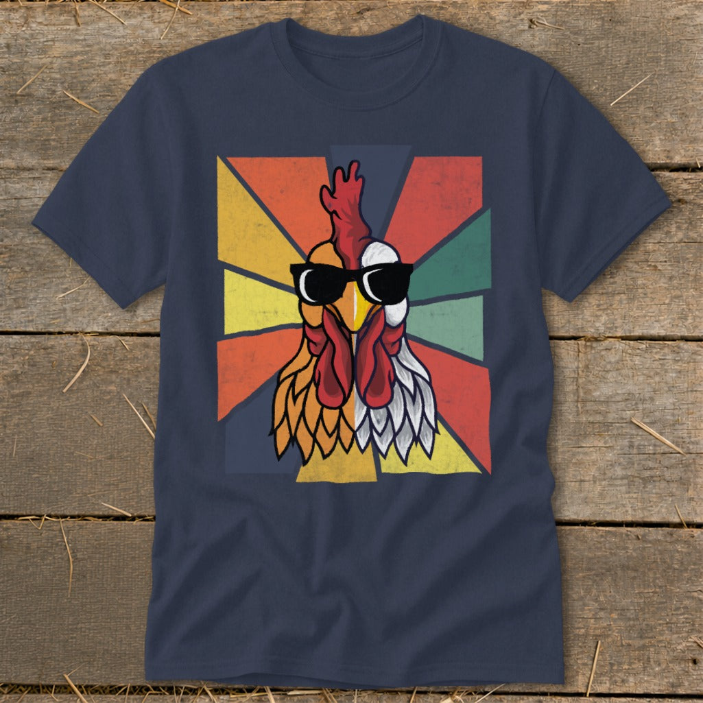Rooster wearing sunglasses on a retro geometric background on a navy t-shirt.