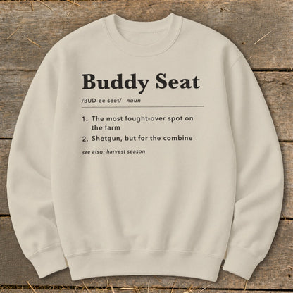 Cream sweatshirt with black text defining "Buddy Seat" and "harvest season".