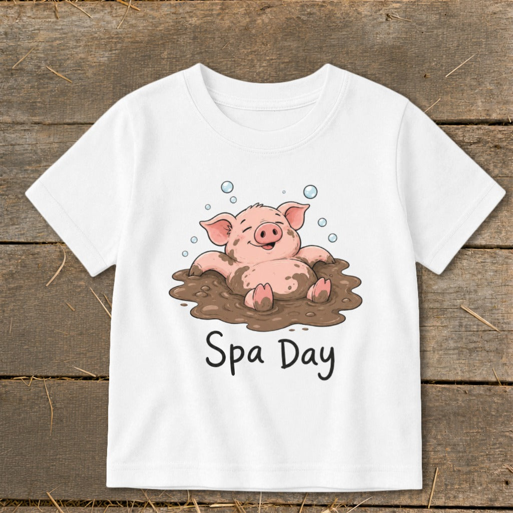 White t-shirt with cartoon pig in mud with text "Spa Day"