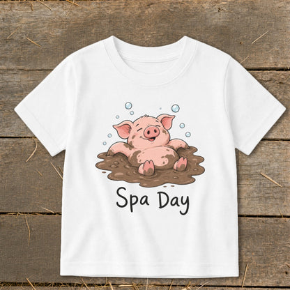White t-shirt with cartoon pig in mud with text "Spa Day"