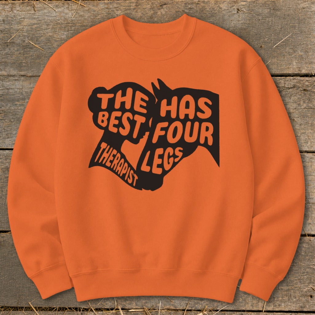 Orange sweatshirt with black text and horse head graphic reading "The Best Therapist Has Four Legs"