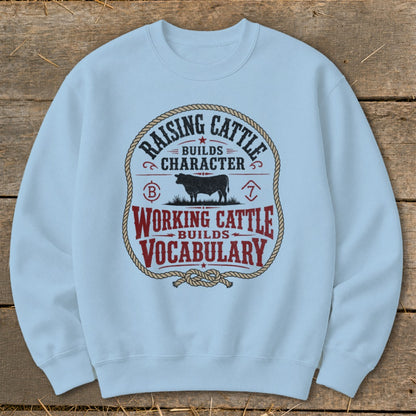 Light blue sweatshirt with "Raising Cattle Builds Character" and "Working Cattle Builds Vocabulary" text.
