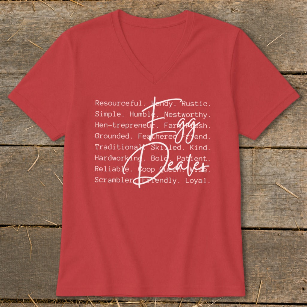 Red V-neck t-shirt with "Egg Dealer" and descriptive words in white text.