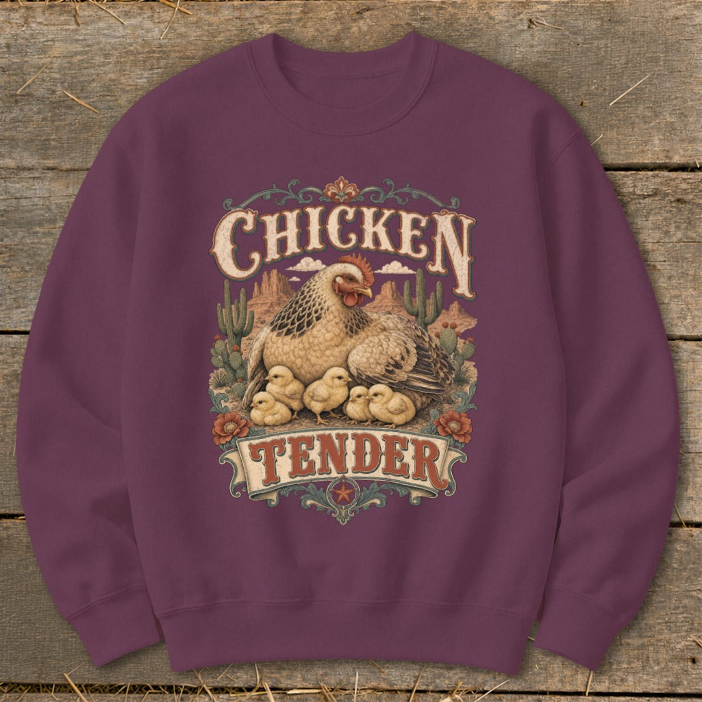 Crimson sweatshirt with "Chicken Tender" graphic featuring hen and chicks in a desert landscape.
