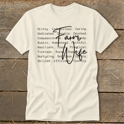 Cream t-shirt with "Farm Wife" text listing adjectives like Gritty, Caring, and Skilled.