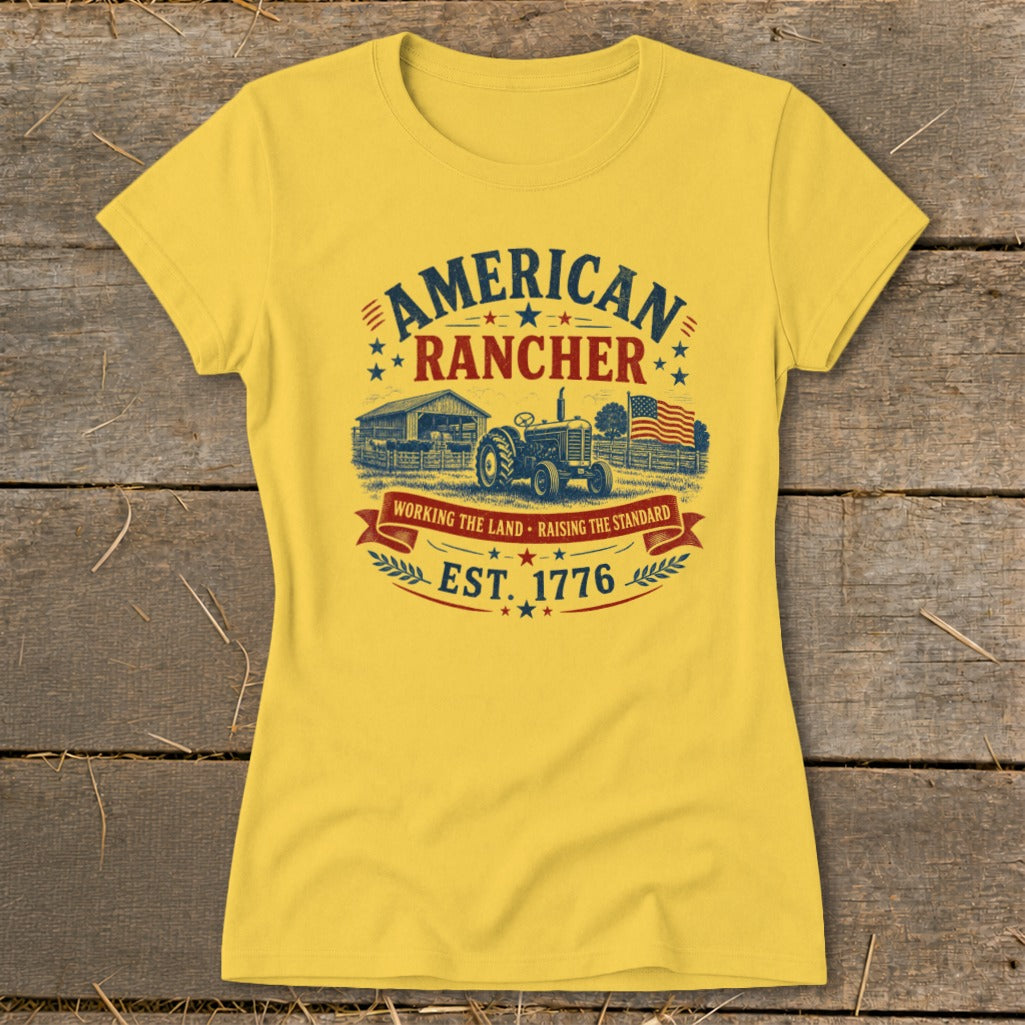 Yellow t-shirt with "American Rancher" graphic featuring tractor, barn, and American flag.