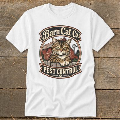 A white t-shirt featuring a circular graphic with a tabby cat, a red barn, and the text Barn Cat Co. Pest Control.