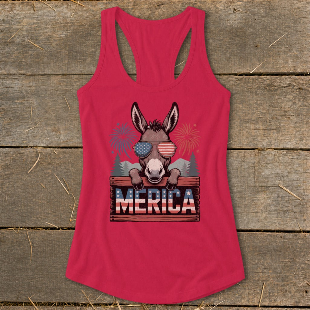 Donkey wearing American flag sunglasses and "MERICA" sign with fireworks.