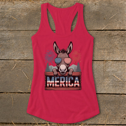 Donkey wearing American flag sunglasses and "MERICA" sign with fireworks.