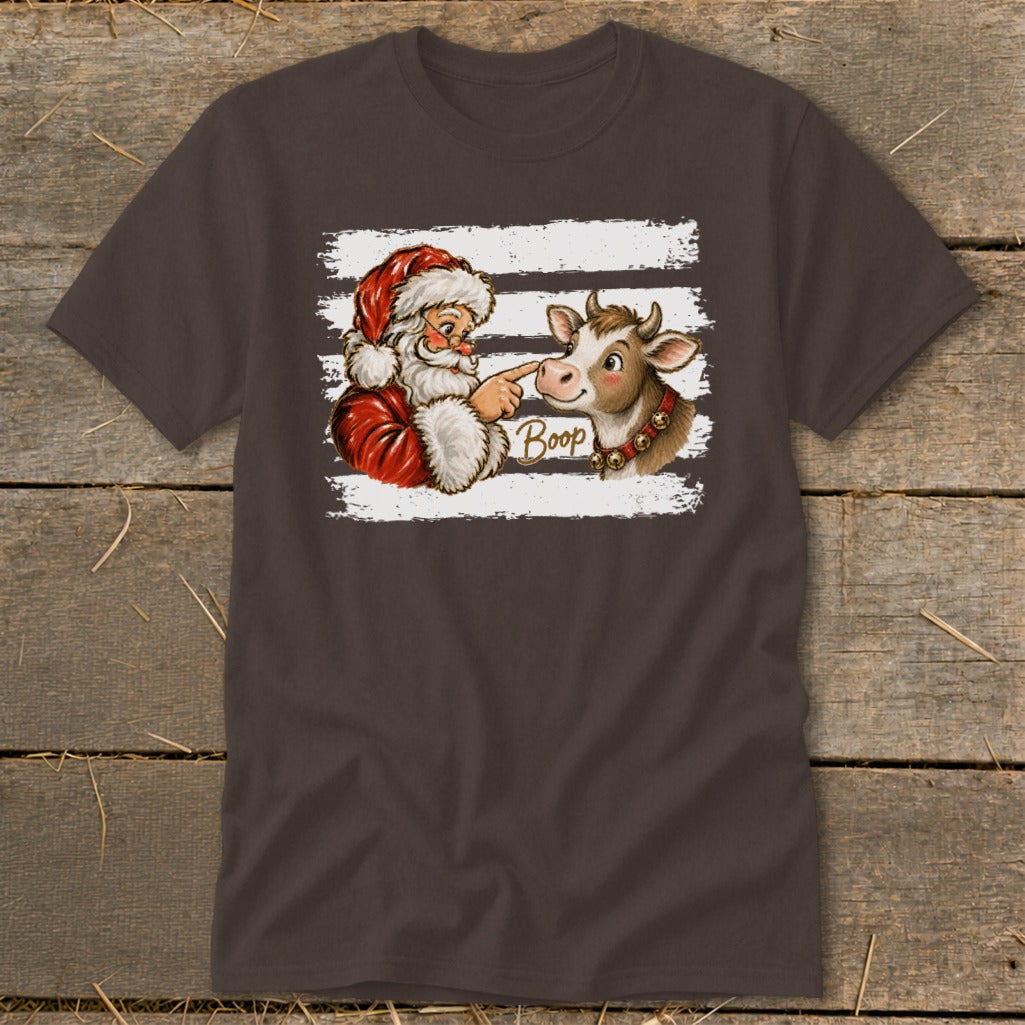 Santa booping a cow's nose with the word "Boop" on a dark brown t-shirt.