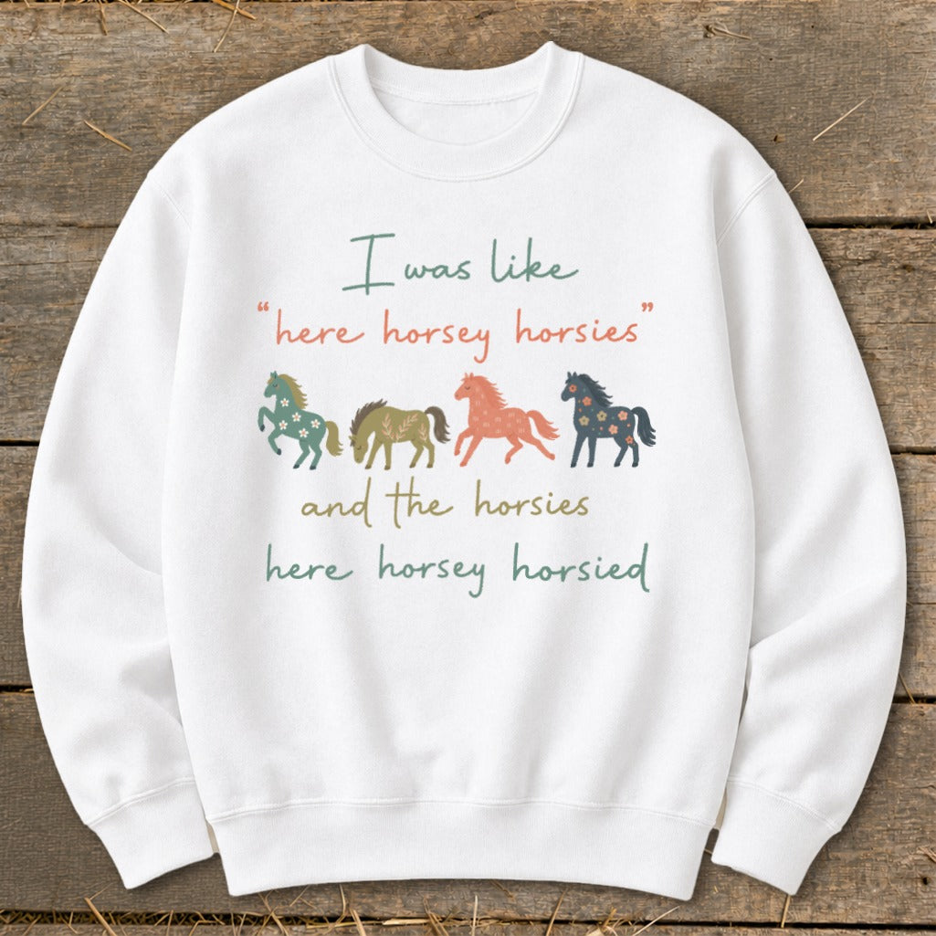 White sweatshirt with four illustrated horses and text "I was like 'here horsey horsies' and the horsies here horsey horsied".