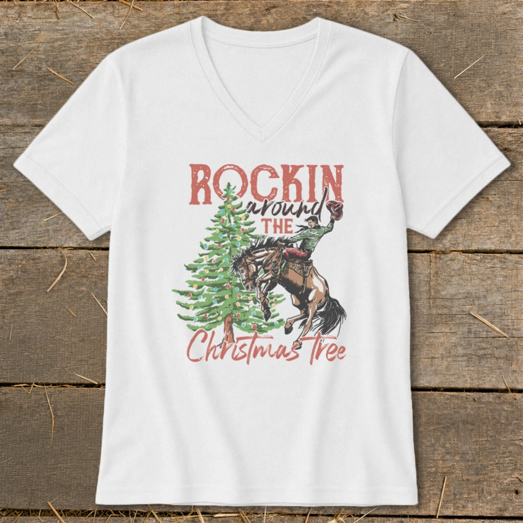 White t-shirt with "Rockin' Around The Christmas Tree" text and rodeo rider on horse.