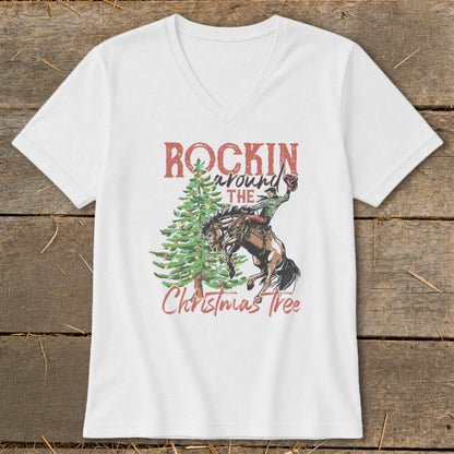 White t-shirt with "Rockin' Around The Christmas Tree" text and rodeo rider on horse.