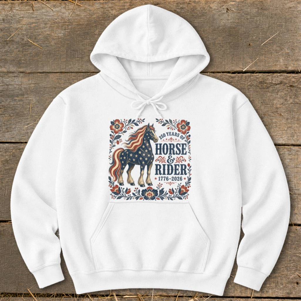 White hoodie with patriotic horse and rider graphic, "250 Years of Horse & Rider 1776-2026" text.