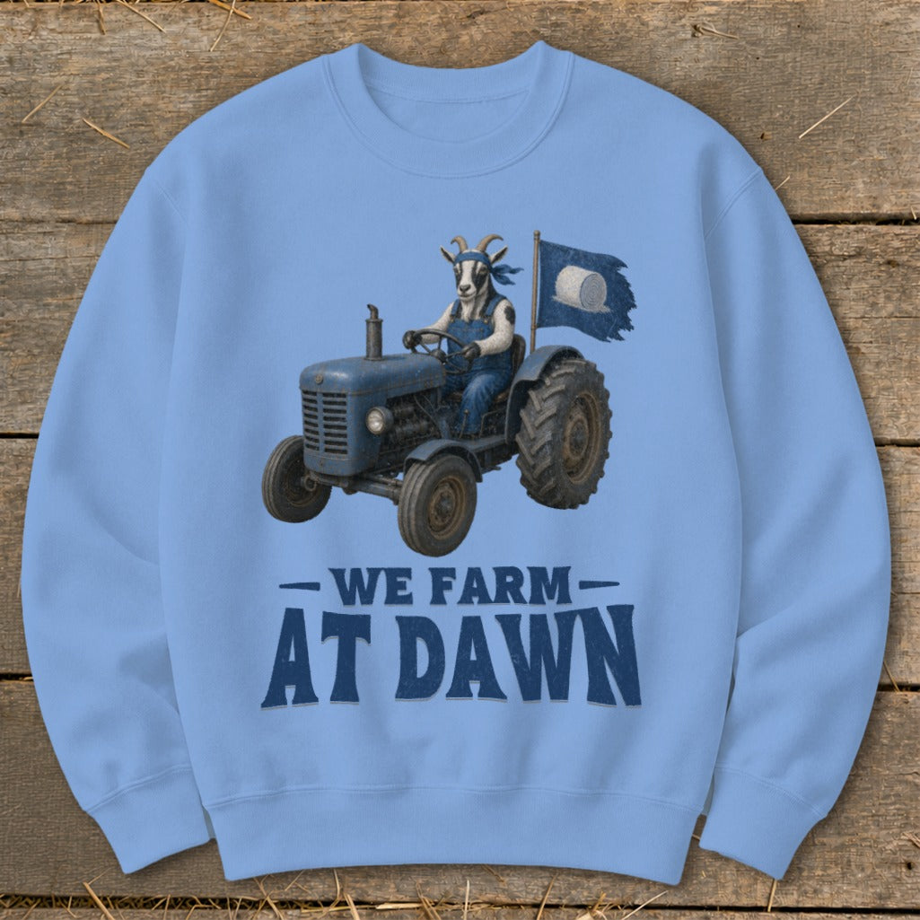 Goat in overalls driving a tractor, with text "We Farm at Dawn".