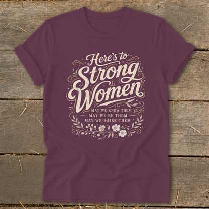 Burgundy t-shirt with "Here's to Strong Women" text and floral design.