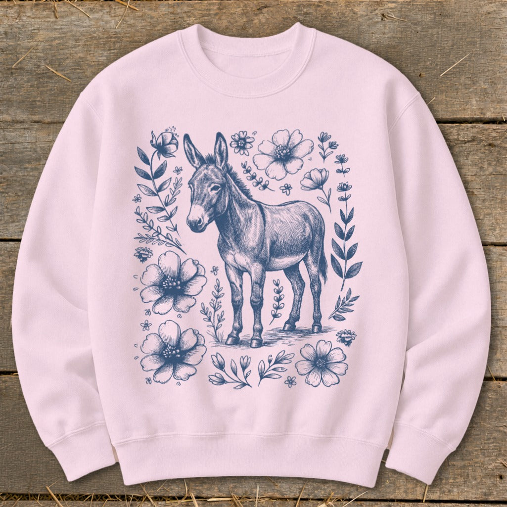 Pink sweatshirt with navy blue sketch of a donkey surrounded by floral elements.