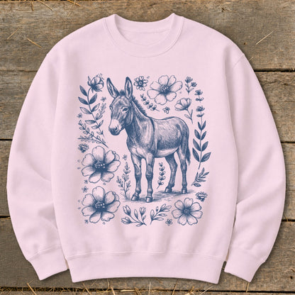 Pink sweatshirt with navy blue sketch of a donkey surrounded by floral elements.