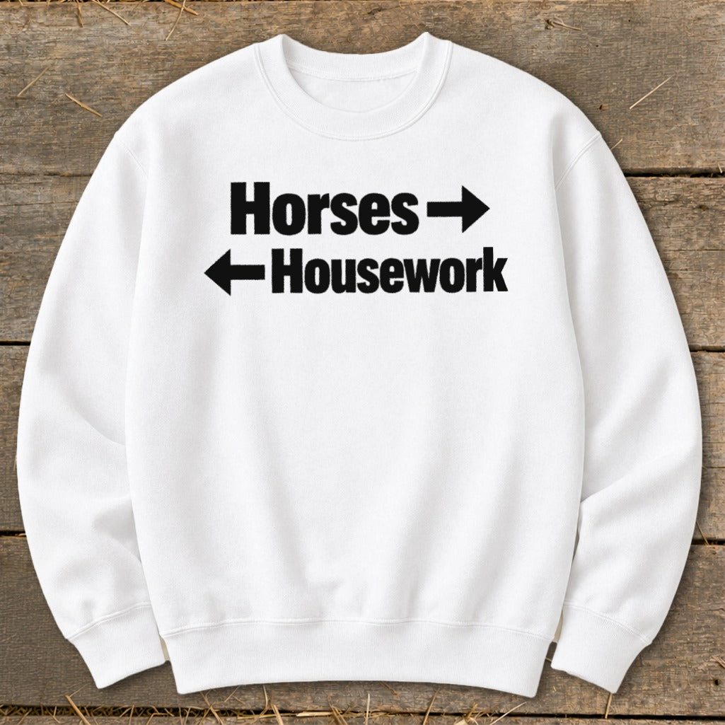 White crewneck sweatshirt with black text reading Horses pointing right and Housework pointing left.