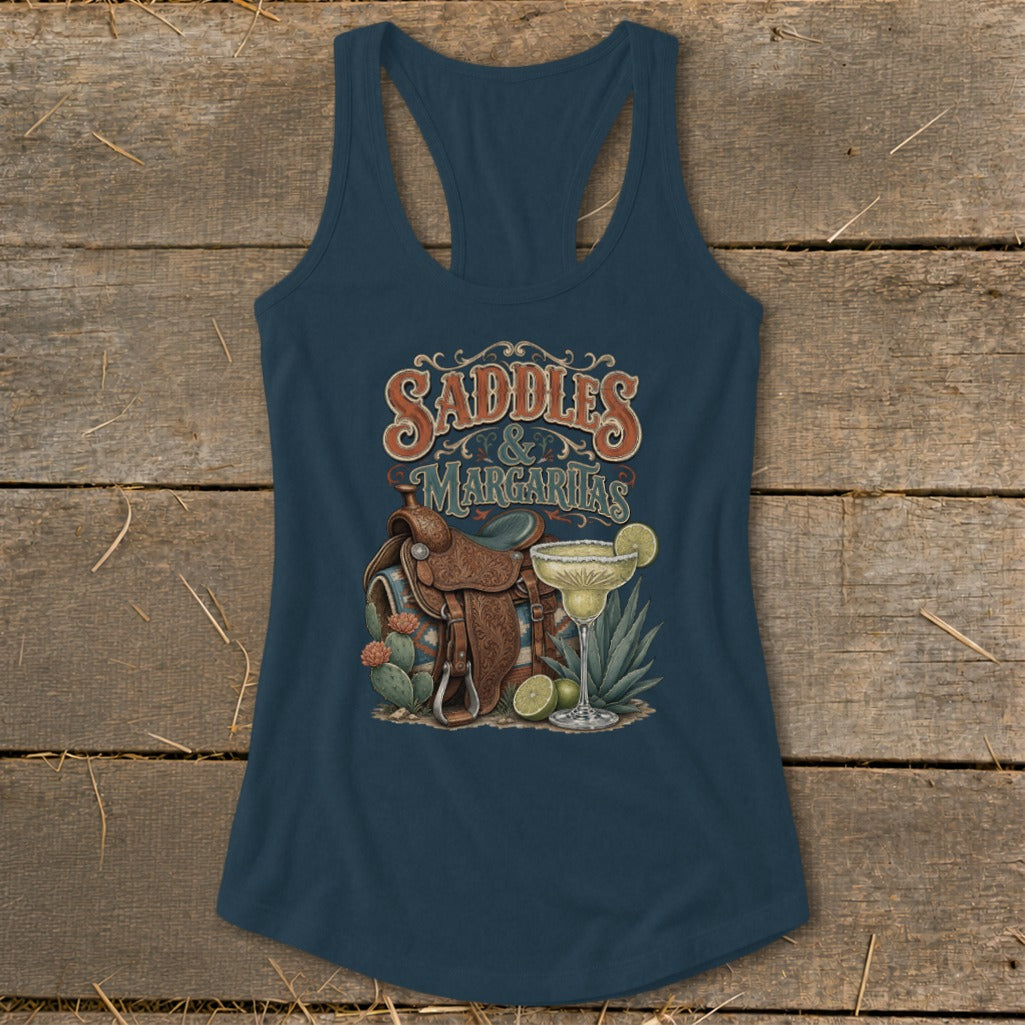 Saddles & Margaritas graphic on a blue tank top with saddle, margarita, and cacti.
