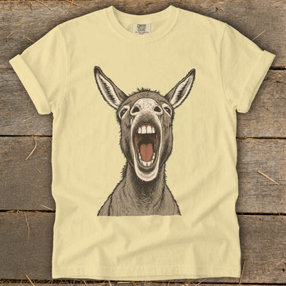 Yellow t-shirt with a cartoon donkey's head roaring with mouth open.