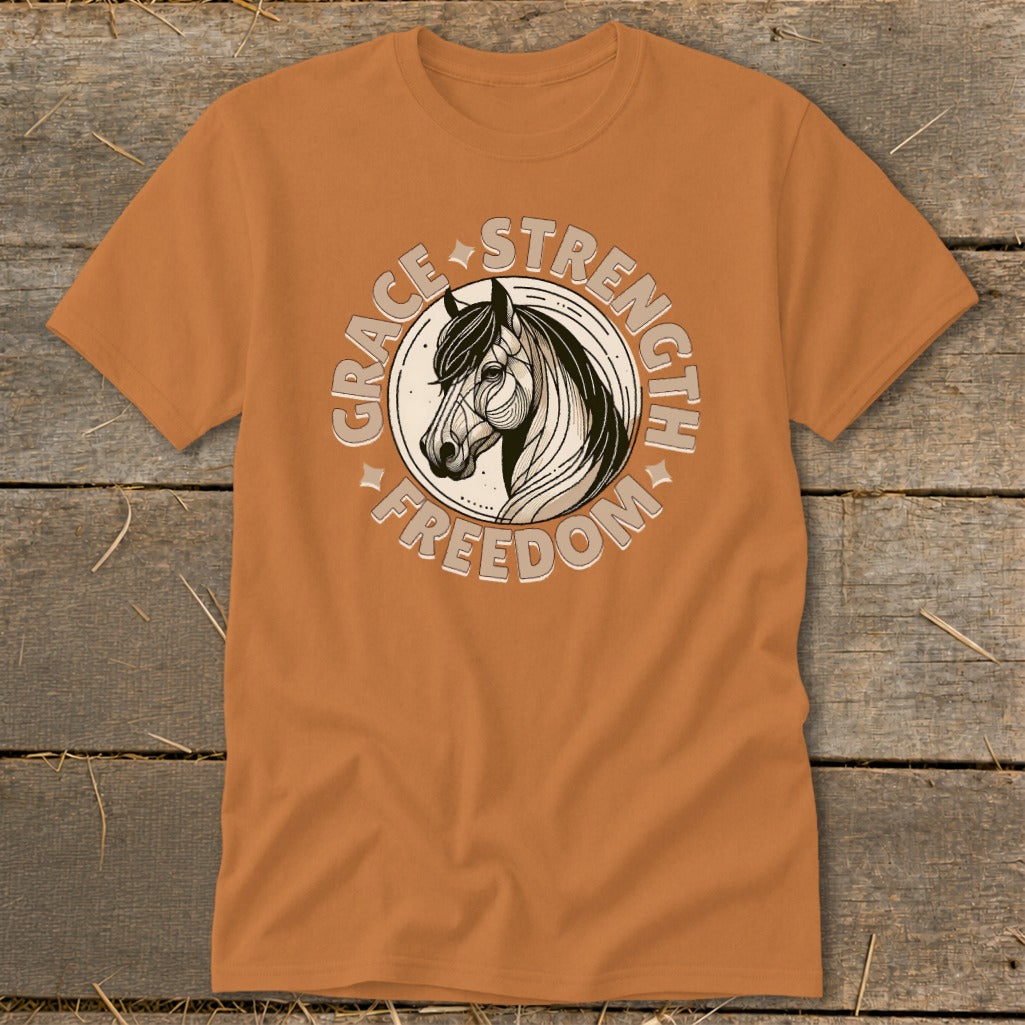 Orange t-shirt with a circular graphic of a horse head and the words Grace, Strength, Freedom.