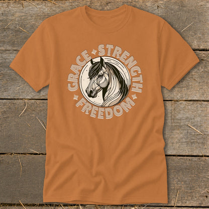 Orange t-shirt with a circular graphic of a horse head and the words Grace, Strength, Freedom.