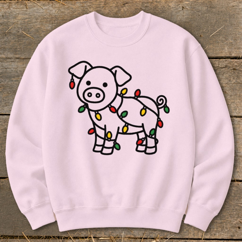 Light pink crewneck sweatshirt featuring a line drawing of a pig wrapped in colorful Christmas lights.